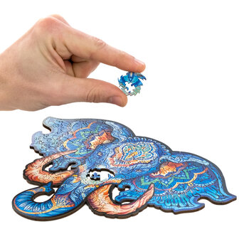 Puzzel Eternal Elephant / Eeuwige Olifant Small het leggen van een stukje