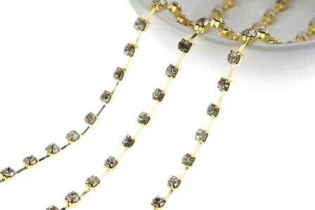Strassketting 5 mm (SS20) Crystal - Gold Cup (per meter)