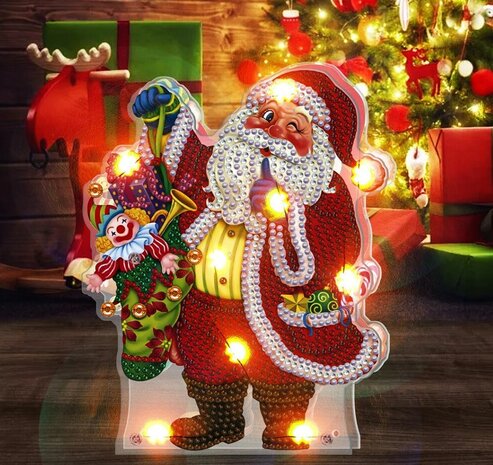 Diamond Painting Kersttafereeltje met verlichting - Knipogende kerstman met zak met speelgoed met verlichting