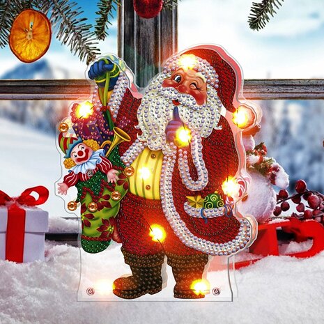 Diamond Painting Kersttafereeltje met verlichting - Knipogende kerstman met zak met speelgoed sfeerfoto 4