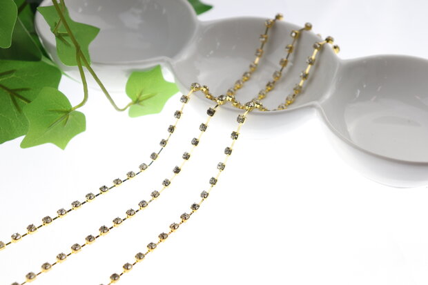 Strassketting 5 mm (SS24) Crystal - Gold Cup (per meter)